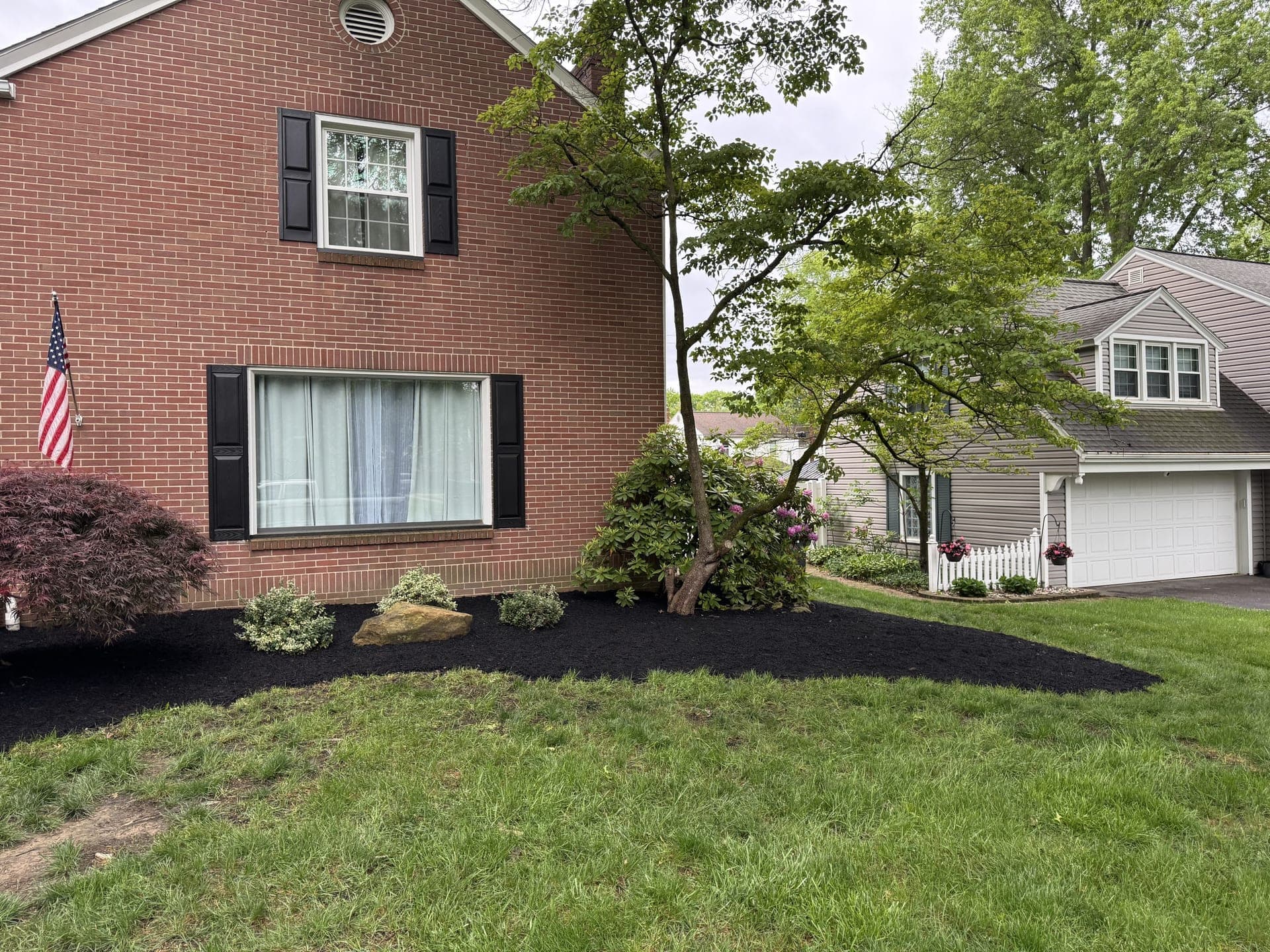 Fresh mulch and clean bed edges after a landscaping refresh at a Mahoning Valley home