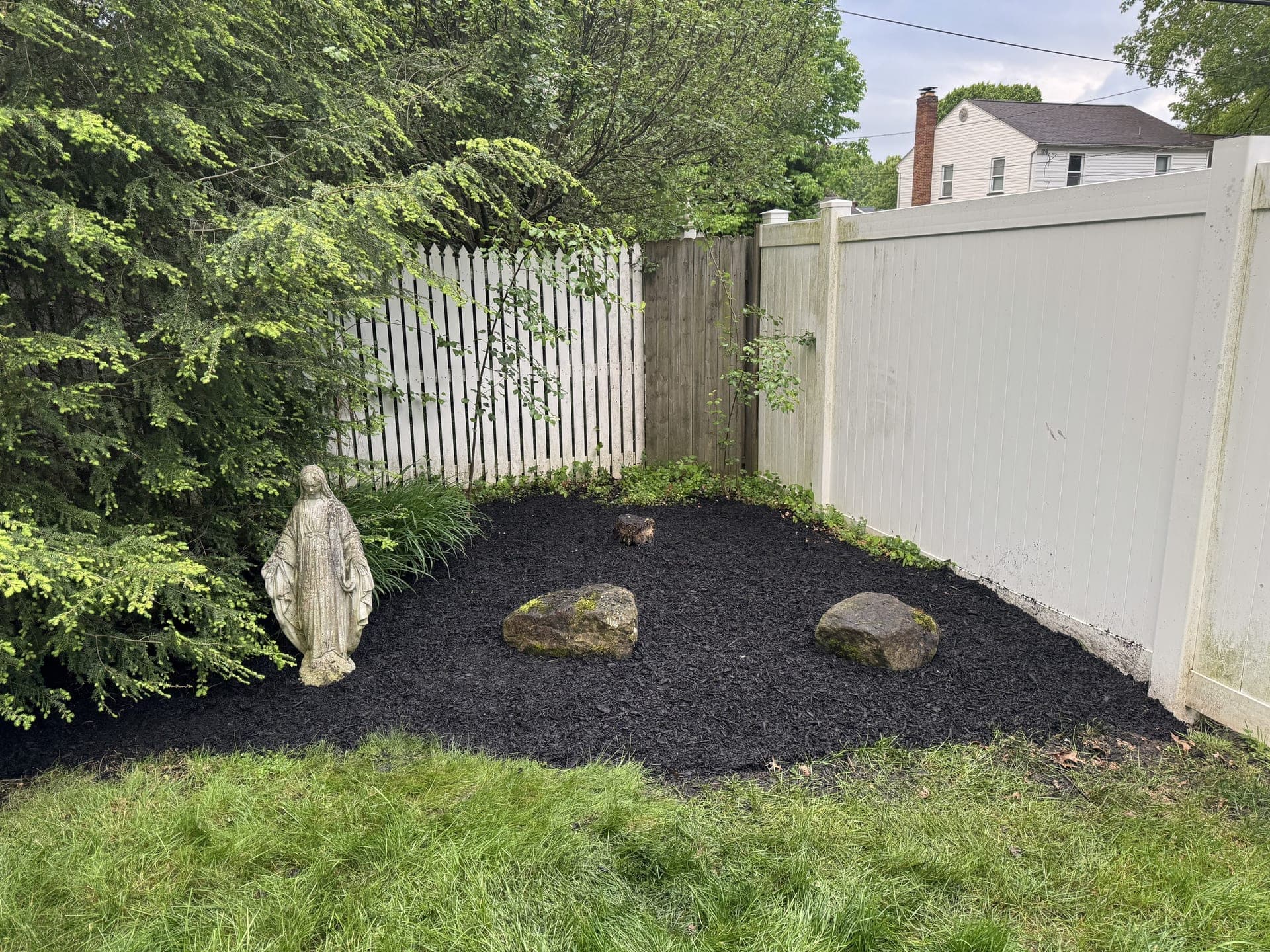 Tidy landscape bed after Porter Property Brothers cleanup